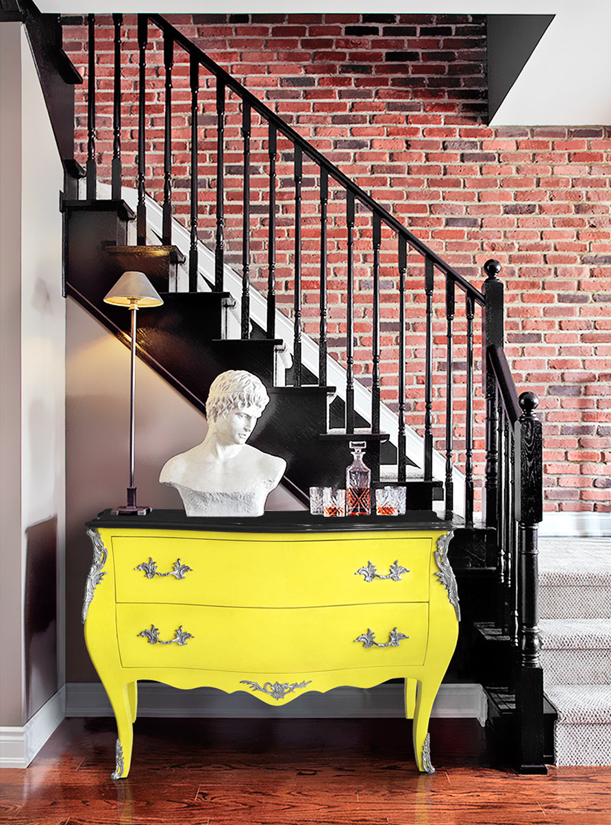 Brick wall associated with a baroque chest of drawers Louis XV style yellow fluo Royal Art Palace